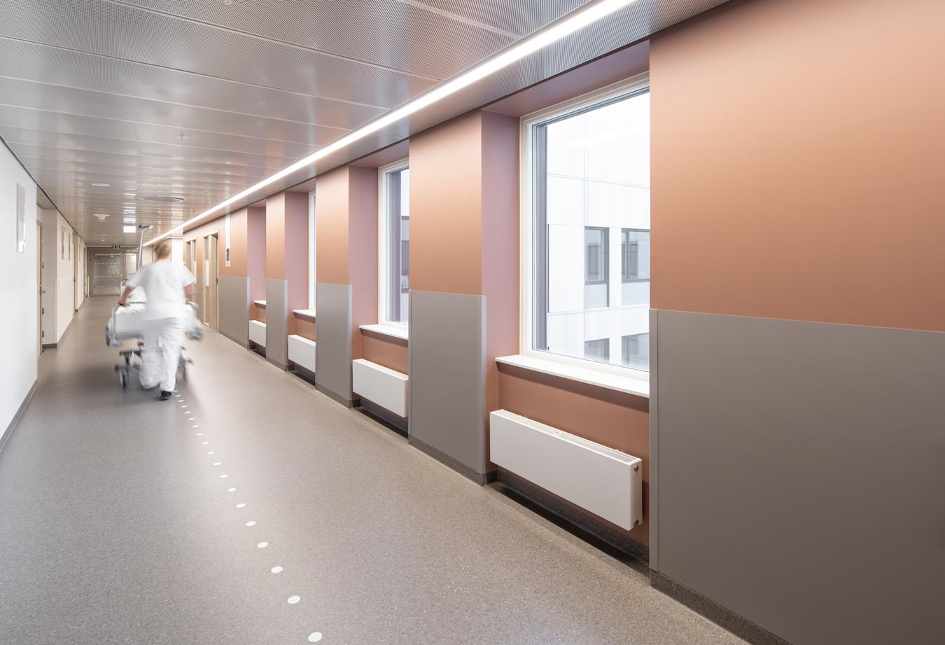 Nurse walking in corridor. Photo