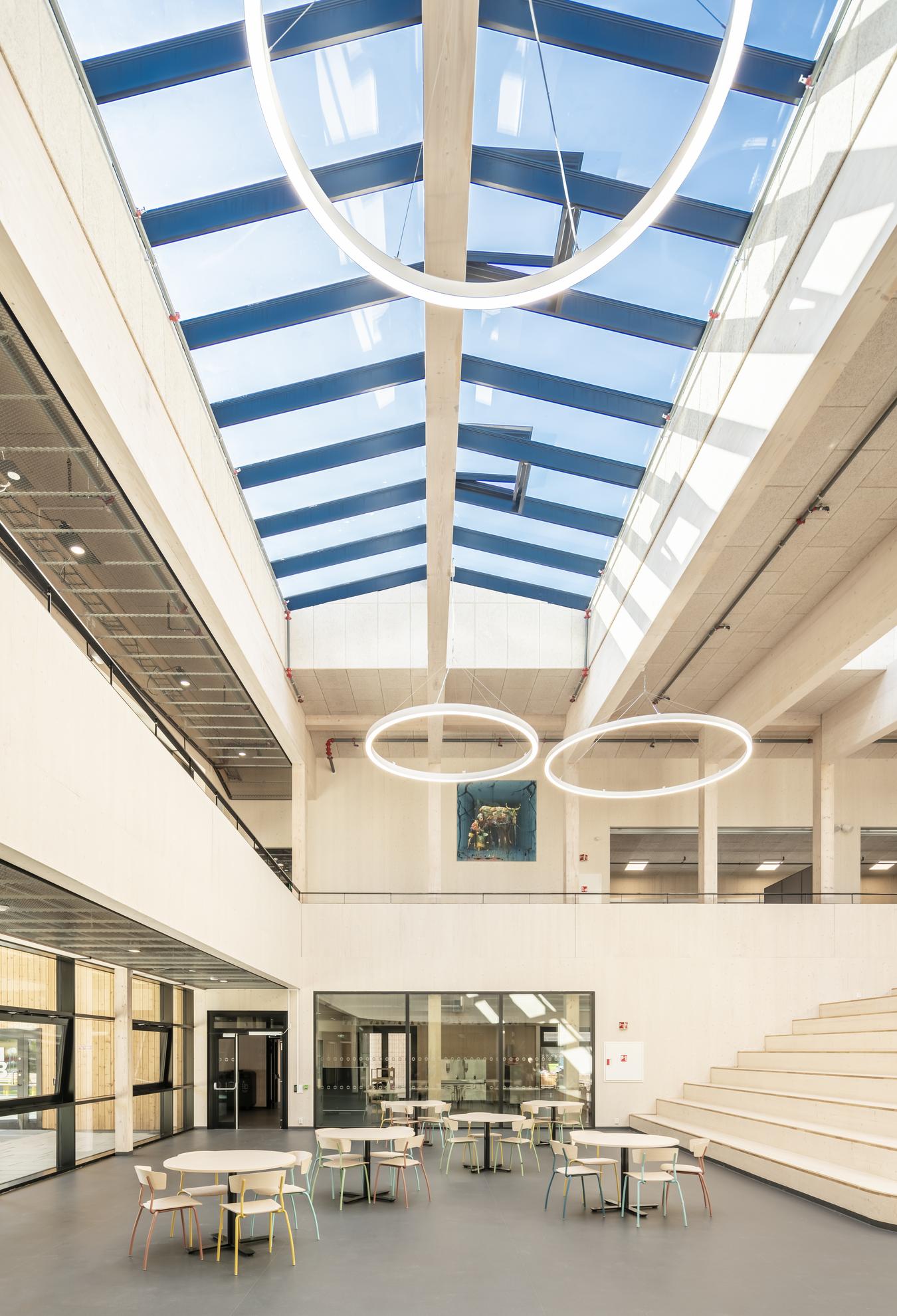 Indoor common area in wood with glass roof. Photo