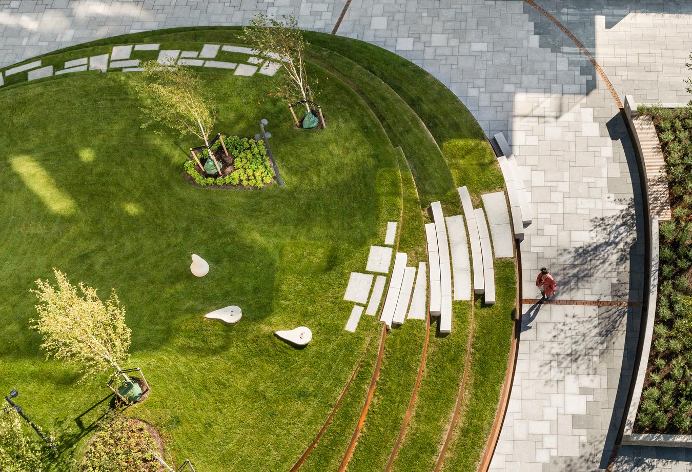 Drone image of courtyard with lawn and stone tiles. Photo