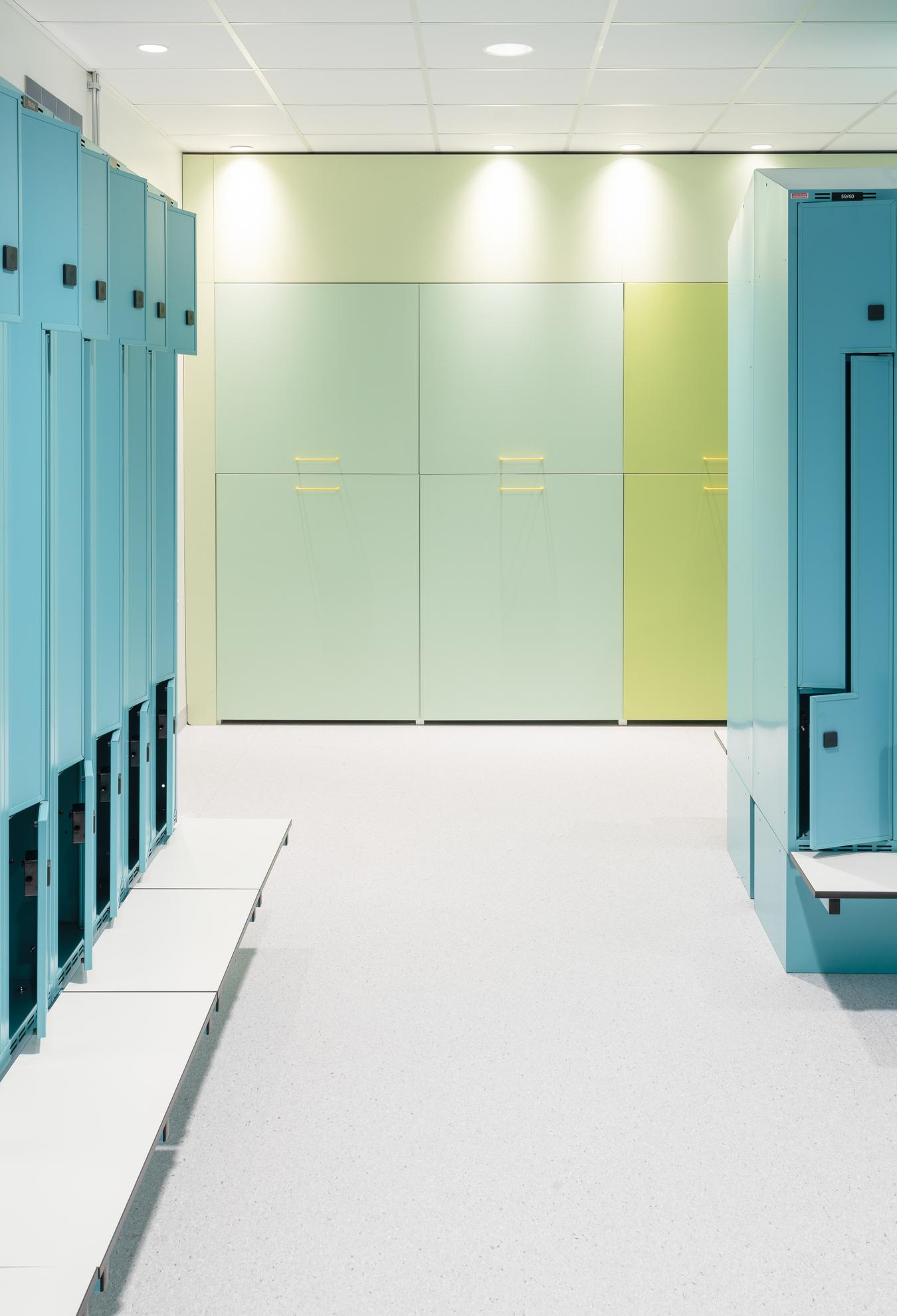 Cabinets and storage in shades of blue and green. Photo