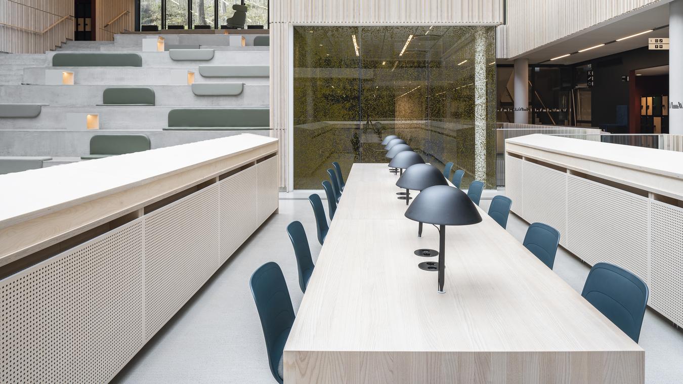 Desk with open common area in the background. Photo