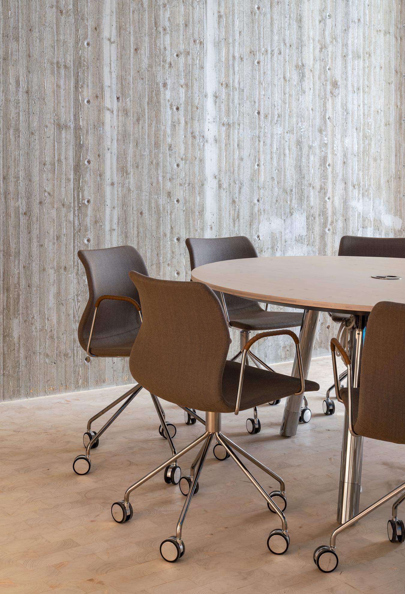 Office chairs around a table. Photo