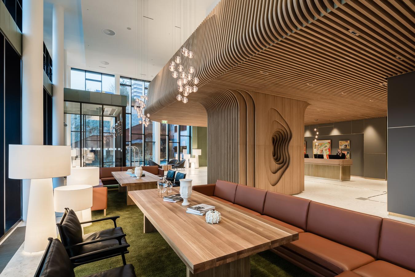 Reception area with roof and details in wooden pillars. Leather furniture and natural colors. Photo